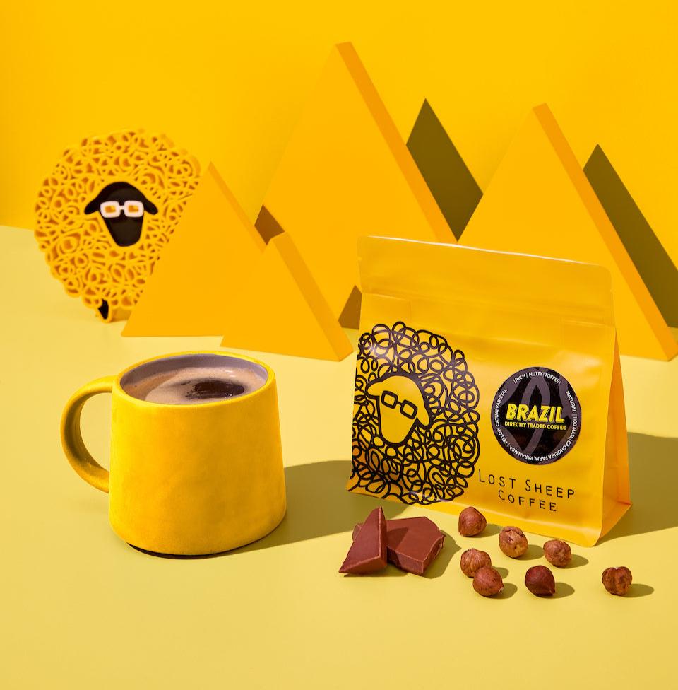Lost Sheep Coffee packaging and yellow mug