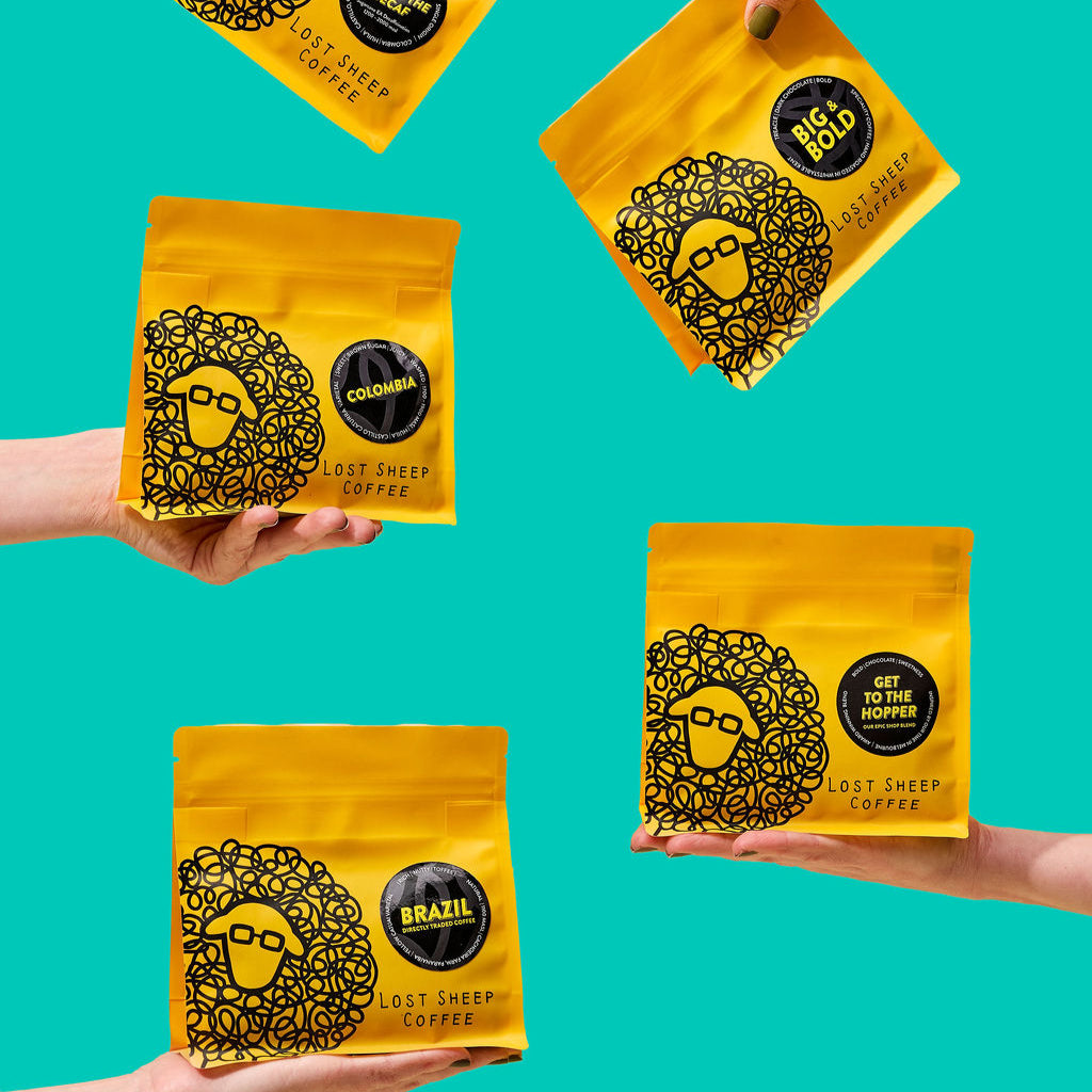 Multiple Coffee Bags being held by hands