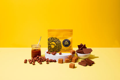 Lost Sheep Coffee's Epic Shop Blend in yellow packaging surrounded by Caramel, hazelnuts, fudge and milk chocolate tasting notes 