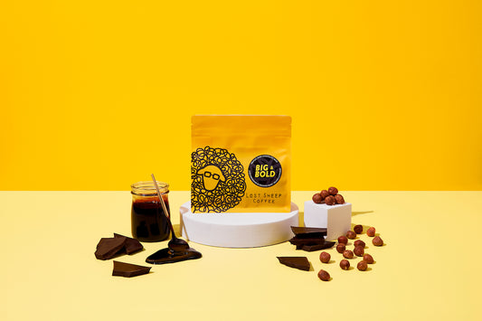 Lost Sheep Coffee's darkest roast in yellow packaging surrounded by Dark treacle, dark chocolate and hazelnut tasting notes