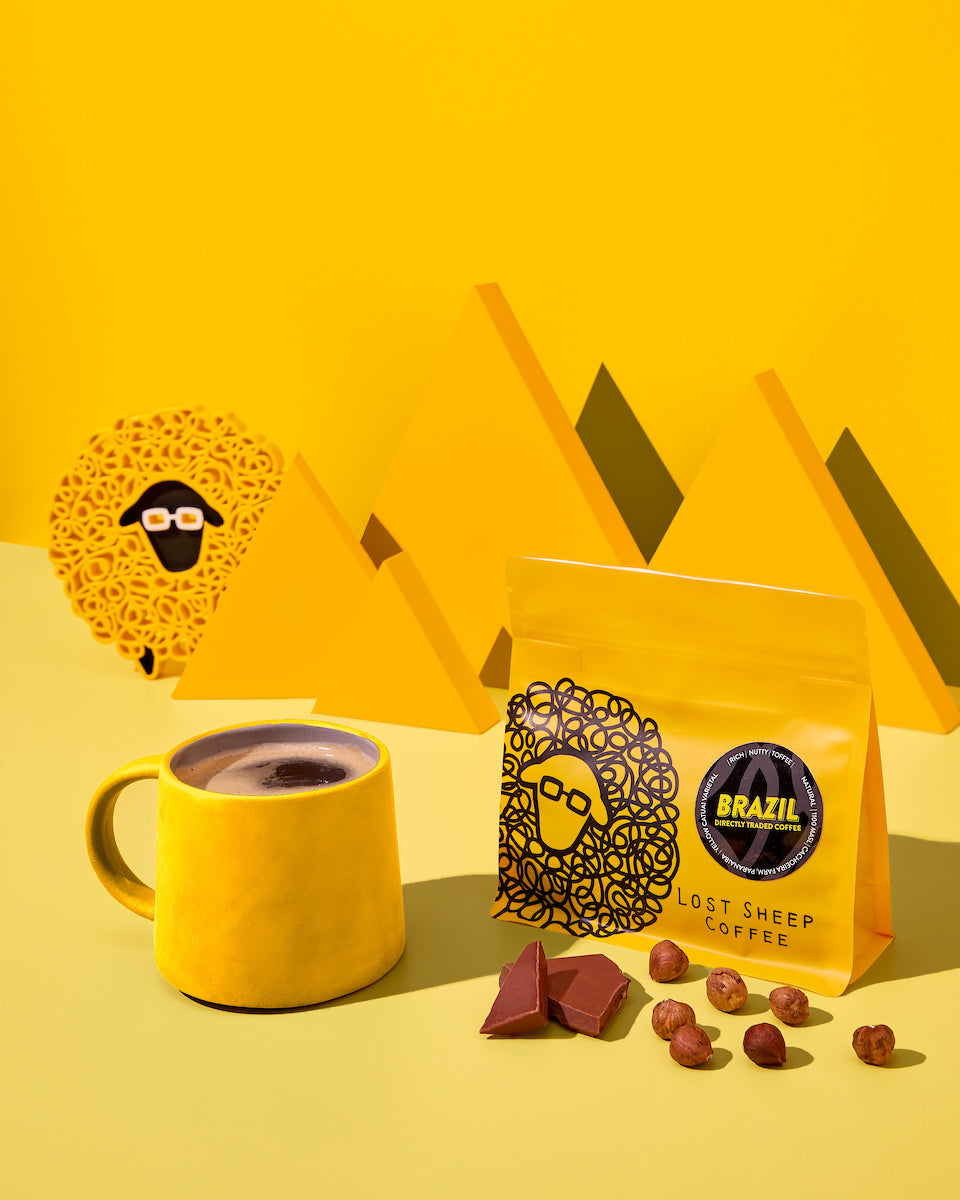 Lost Sheep Coffee packaging and yellow mug
