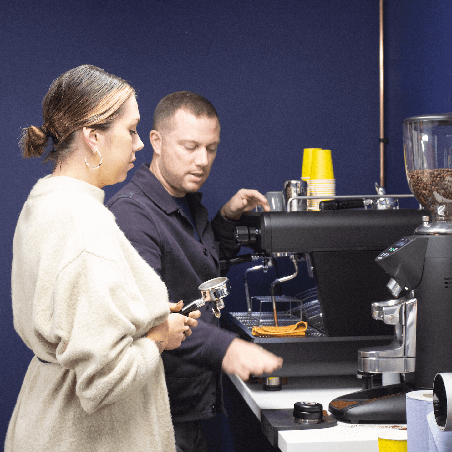 2 people working at espresso machine - Commercial Barista Basics course